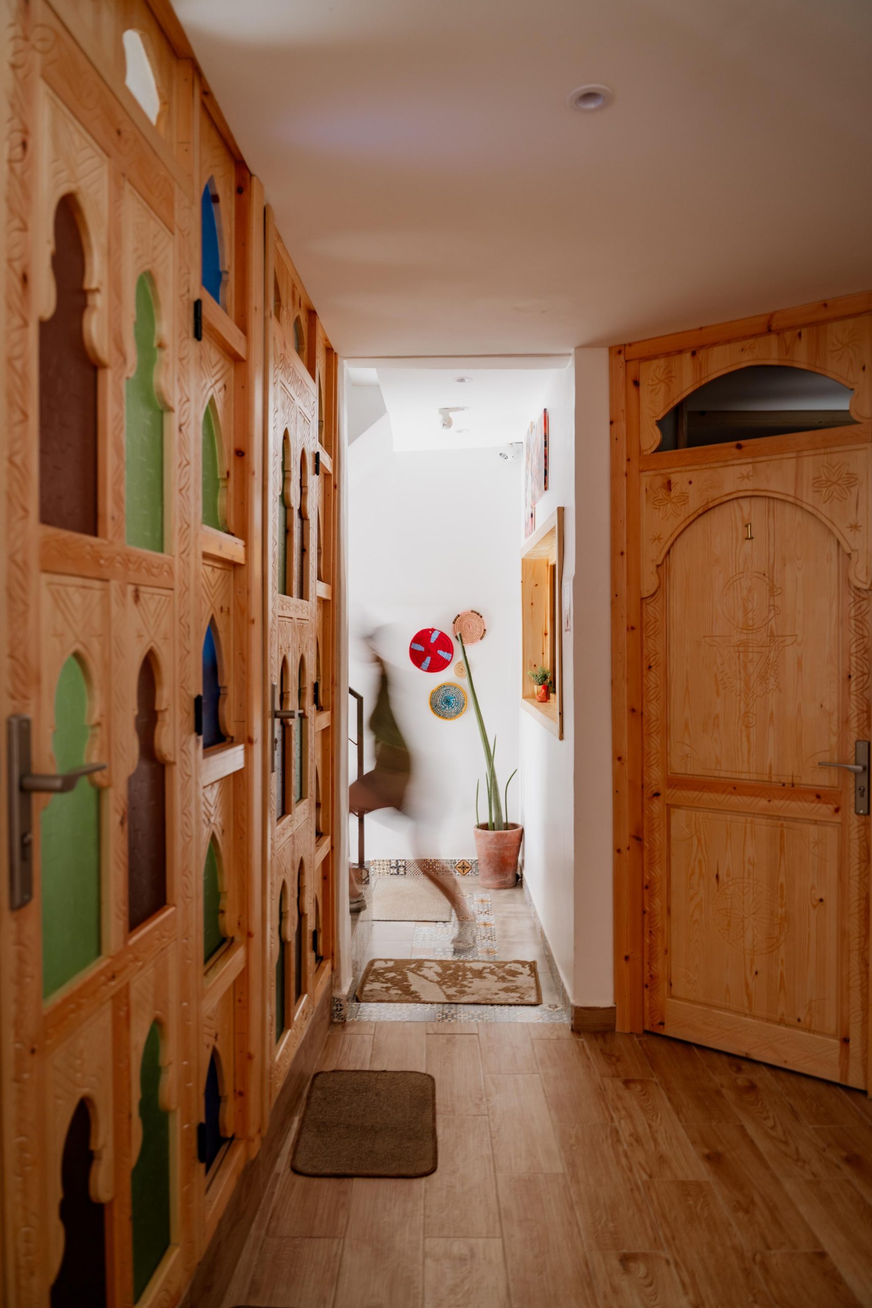 Traditional wooden doors and hallway at Tafokt Surf House